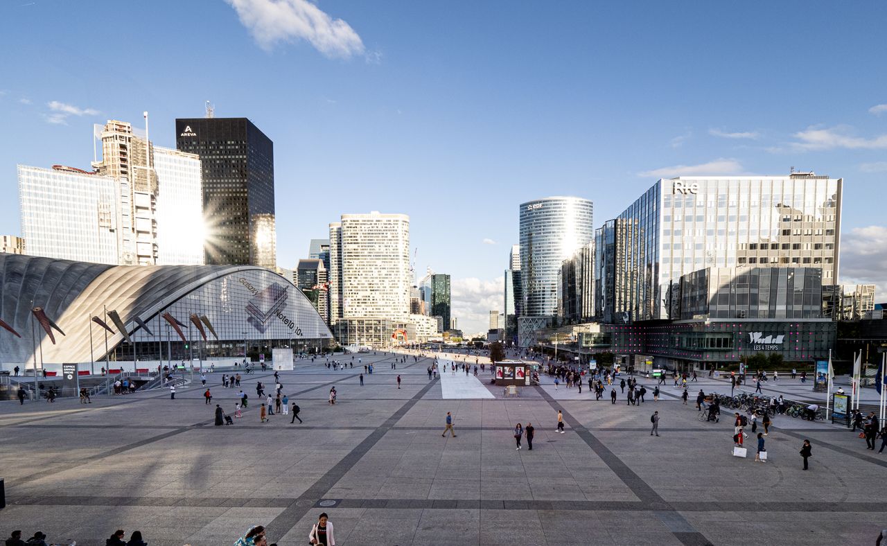 View of modern skyscrapers in La Défense district, Paris, on a sunny day.